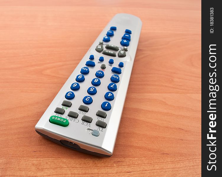 TV remote control on a wooden table