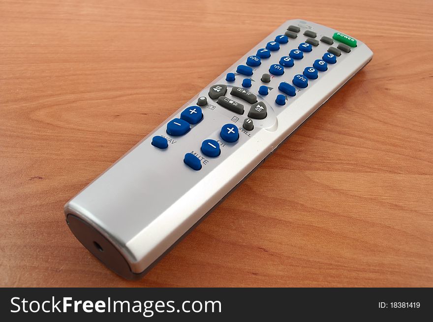 TV remote control on a wooden table