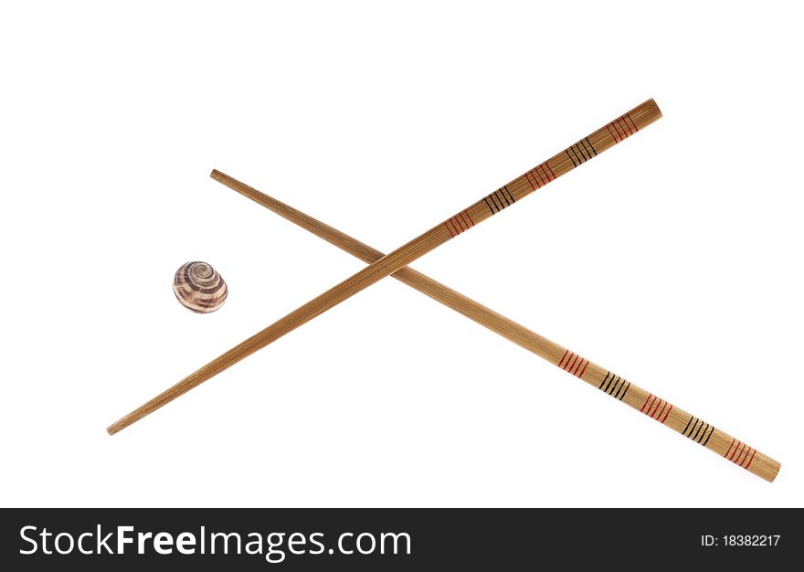 Chopsticks and snail isolated on white background