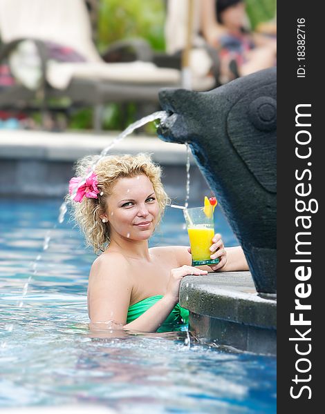Young beautiful womam relaxing in pool. Young beautiful womam relaxing in pool