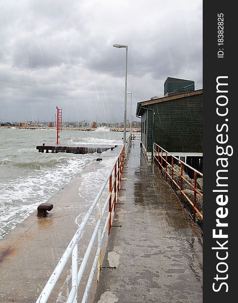 Storm and waves on the pier. Storm and waves on the pier