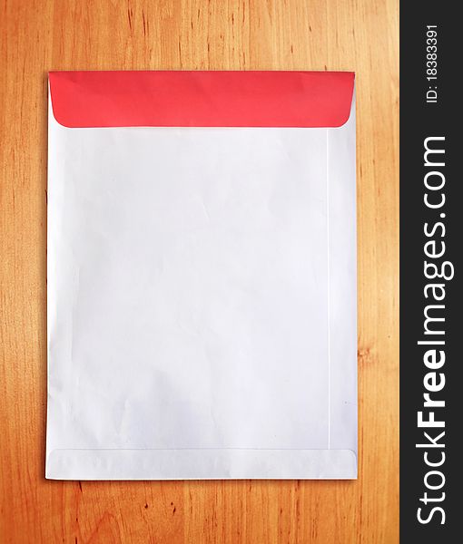 Old document envelope on wood table background