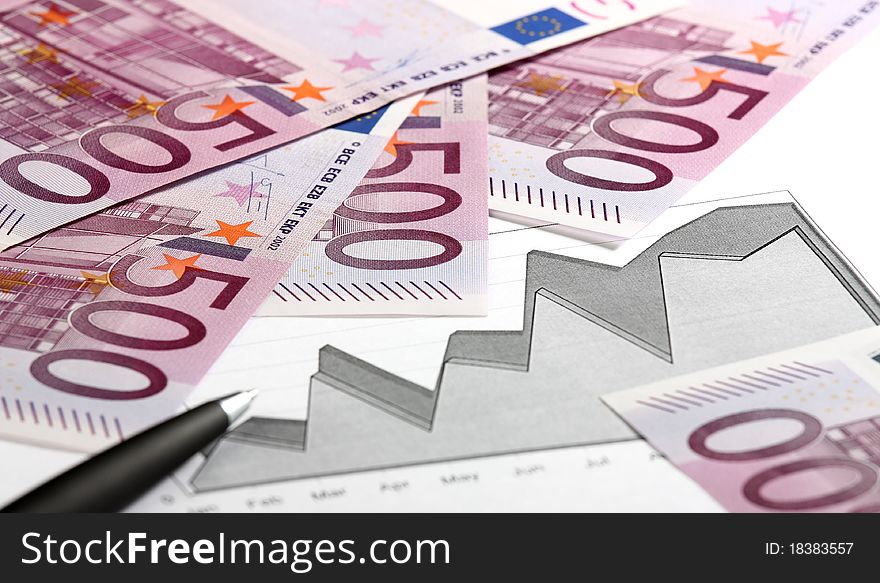 Close-up of euro banknotes, graphs and pen. Close-up of euro banknotes, graphs and pen