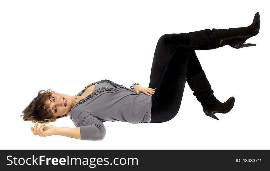 Young woman lays on floor isolated portrait on the white background. Young woman lays on floor isolated portrait on the white background.