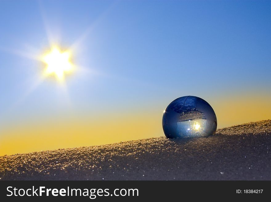 Glass globe in the snow.