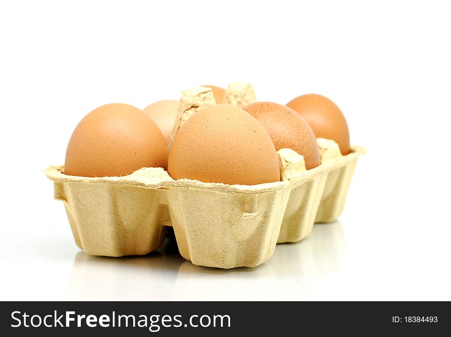 Eggs in box isolated on white background. Eggs in box isolated on white background.