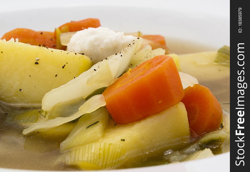 Carrots, potatoes and onions in a soup with horseradish. Carrots, potatoes and onions in a soup with horseradish