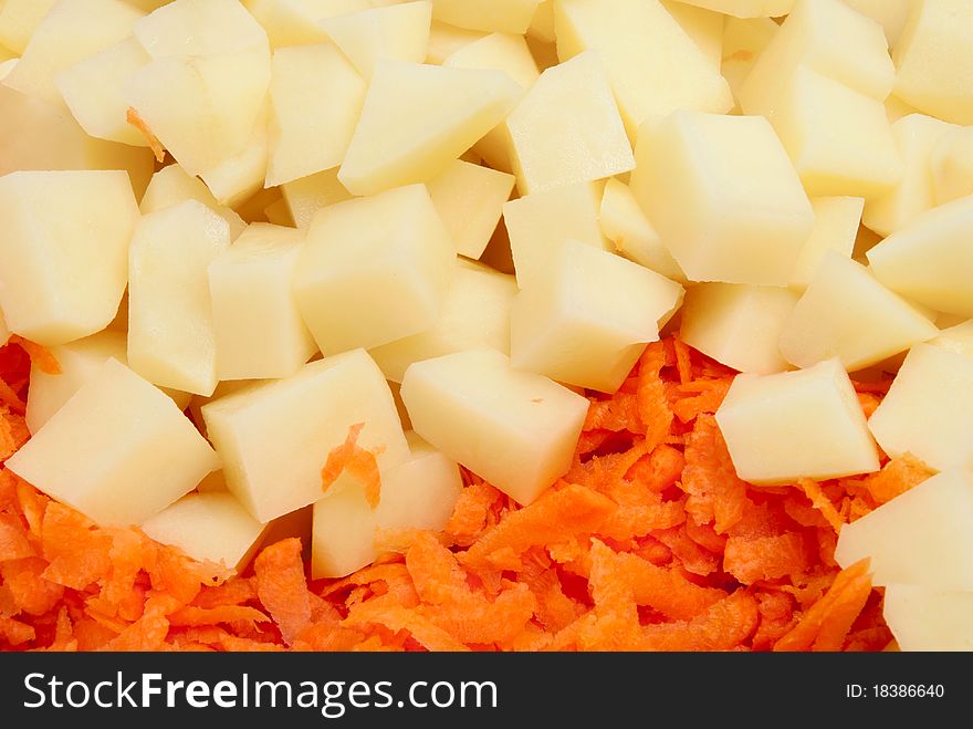 Slices Of A Potato And Grated Carrots