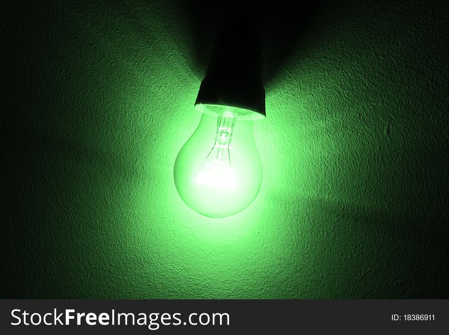 Concept of lighten light bulb. Green photo filter. Concept of lighten light bulb. Green photo filter