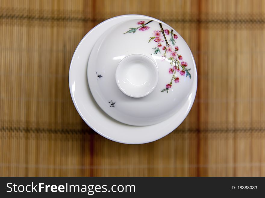 Chinese teacup on straw mat