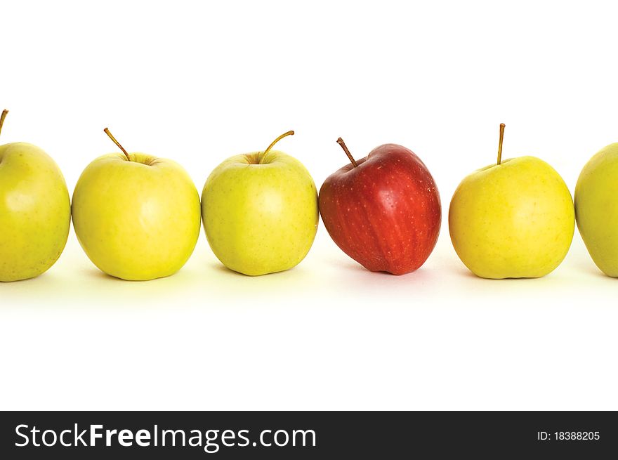 Line of green apples and one red apple. Line of green apples and one red apple