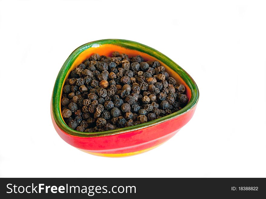 Black pepper in small ceramic bowl isolated on white background. Black pepper in small ceramic bowl isolated on white background