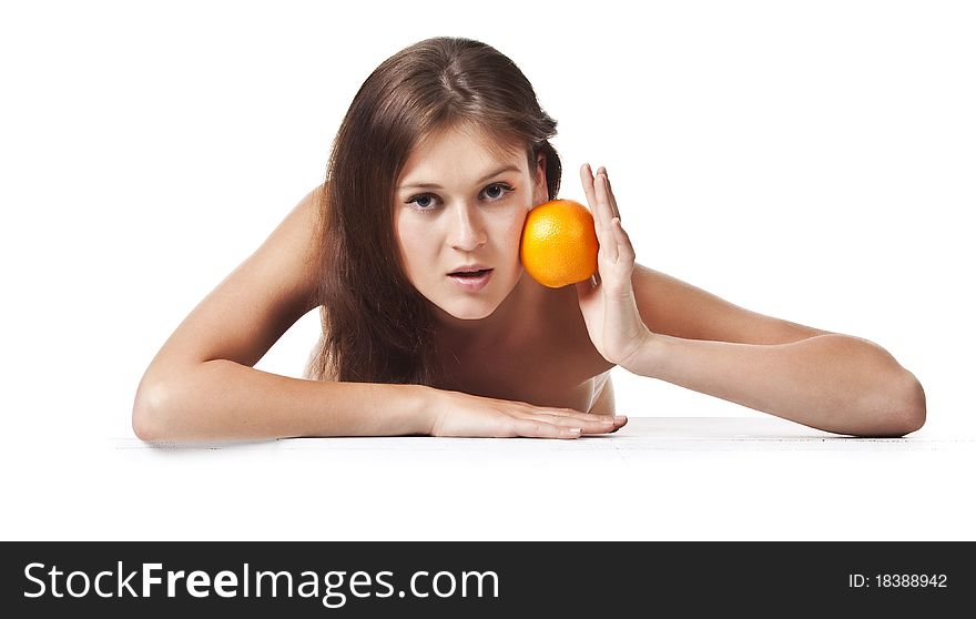 The adult woman with an orange fruit