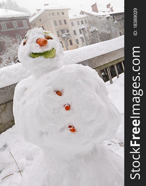 Kids made a snow man in the historical centre of Ljubljana. Kids made a snow man in the historical centre of Ljubljana