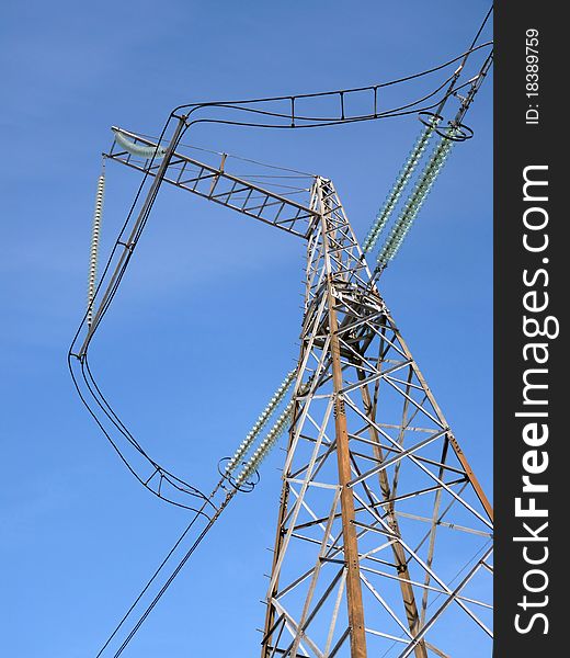 Power lines against the  blue sky