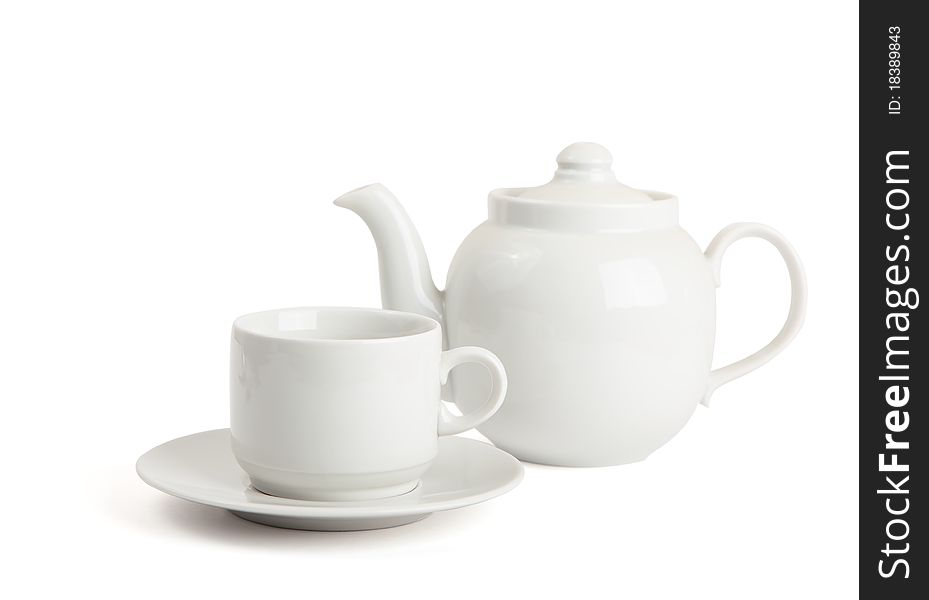 Cup and the teapot is isolated on a white background