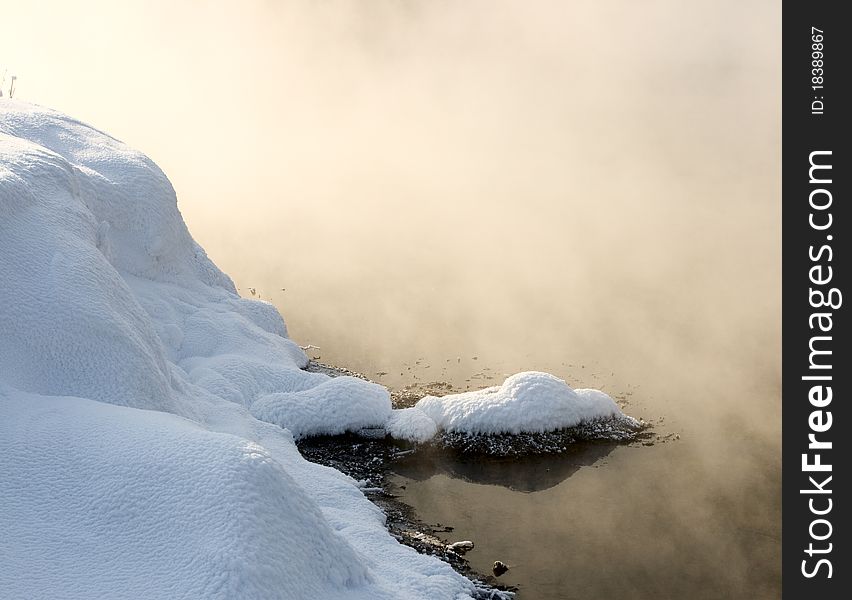 Fog over the unfrozen river in winter. Fog over the unfrozen river in winter