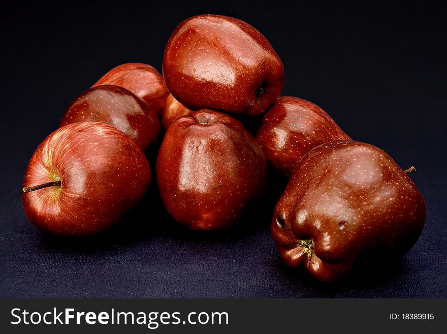 Photo from delicious red apples with dark background.