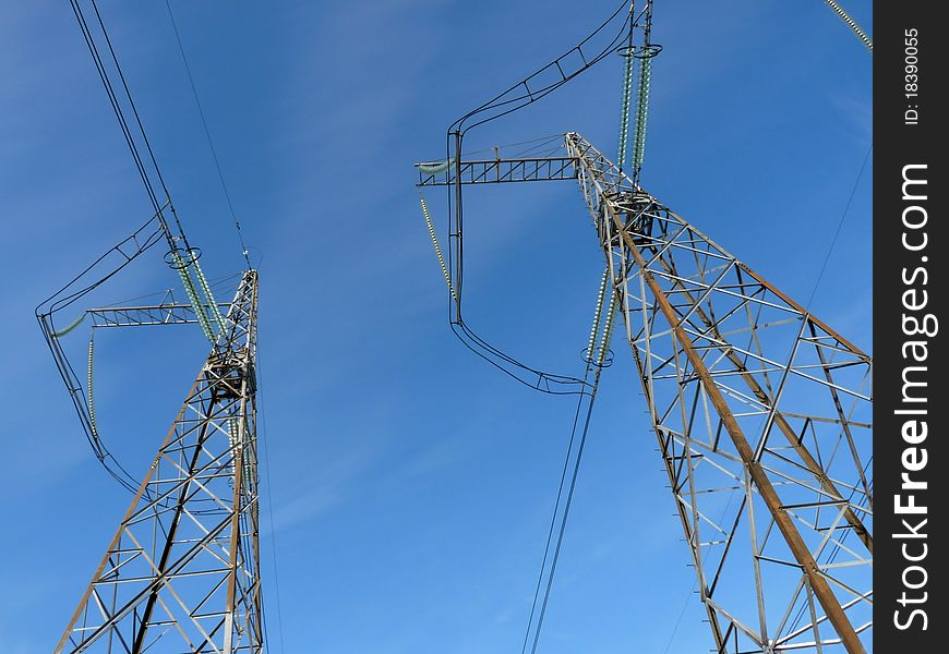 Power lines against the clear blue sky
