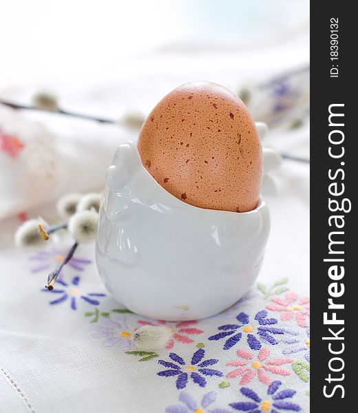 Easter Egg with a willow branch in eggcup