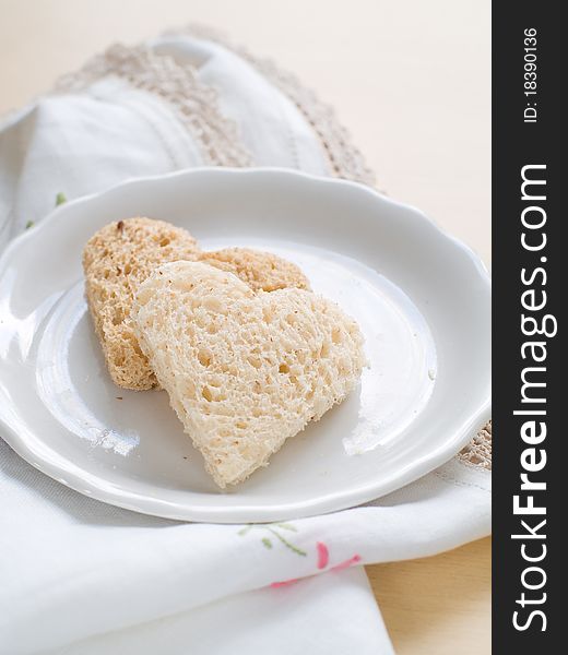 Heart shaped homemade brown bread with cereals