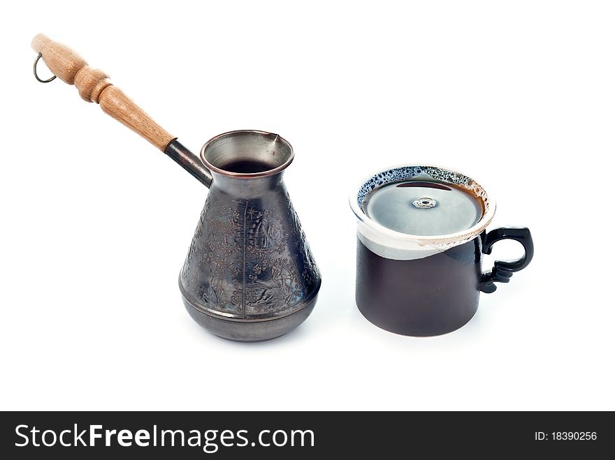 Cup of coffee and metal coffee pot. Cup of coffee and metal coffee pot