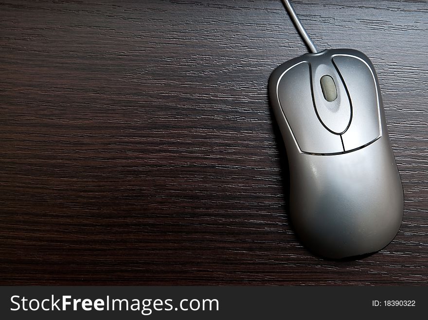 Single silver pc mouse on table. Studio shot. Single silver pc mouse on table. Studio shot