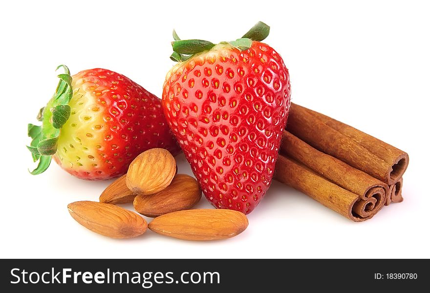 Strawberry with almonds and cinnamon on a white background