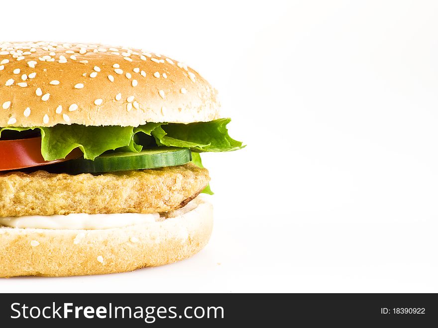 Chicken burger with tomato cucumber lettuce and mayonnaise over white