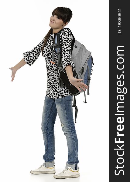 Young student with his backpack, the picture is done in studio, isolated on white. Young student with his backpack, the picture is done in studio, isolated on white