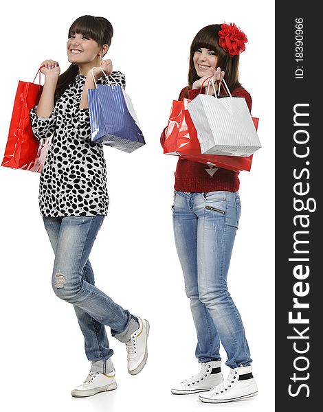 Two friends shopping with gift bags in hand. Two friends shopping with gift bags in hand