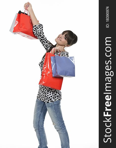 Young woman shopping with gift bags in hand. Young woman shopping with gift bags in hand