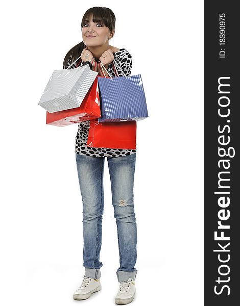 Young woman shopping with gift bags in hand. Young woman shopping with gift bags in hand