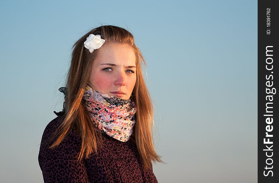 Portrait of a beautiful girl in the cold