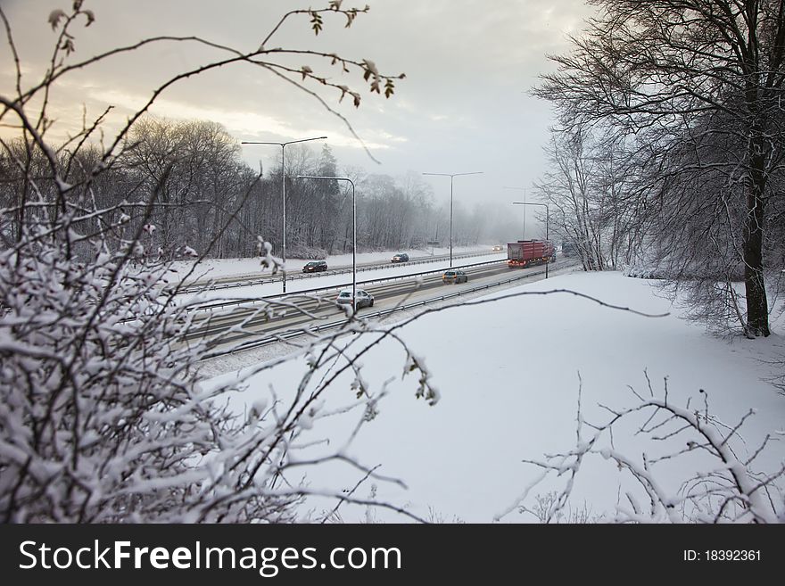 Traffic on a snowy highway in winter. Traffic on a snowy highway in winter