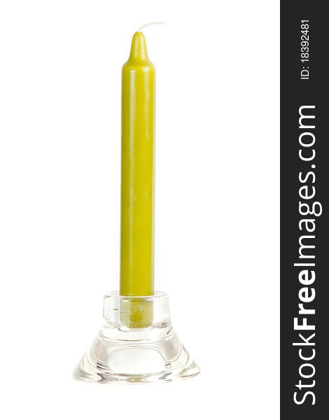 Glass candlestick with green candle isolated on whie background