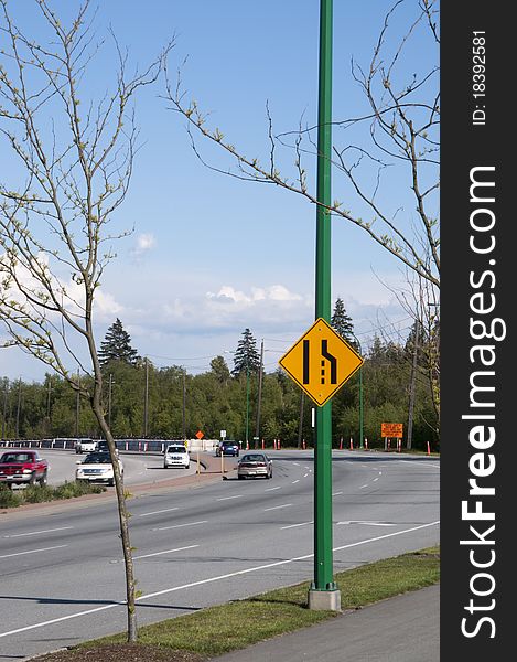 Road narrow sign with traffic car