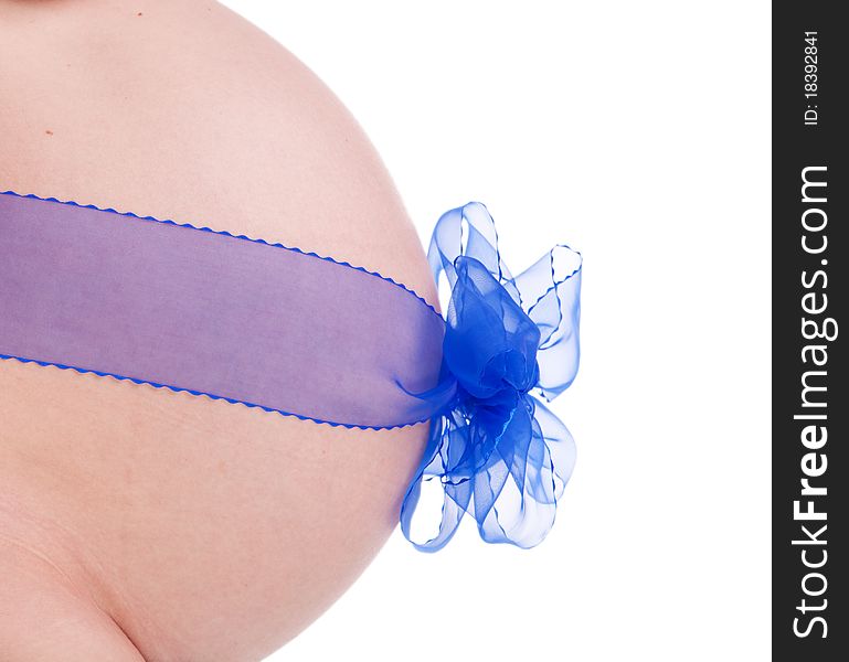 Abdomen of a pregnant girl with a blue ribbon isolated on white. Abdomen of a pregnant girl with a blue ribbon isolated on white