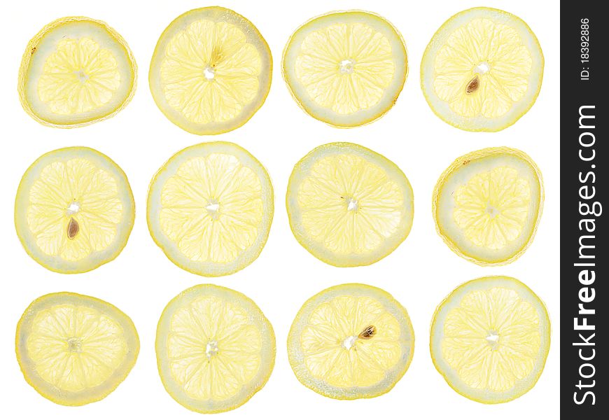 Twelve lemon slices on white background. Twelve lemon slices on white background.