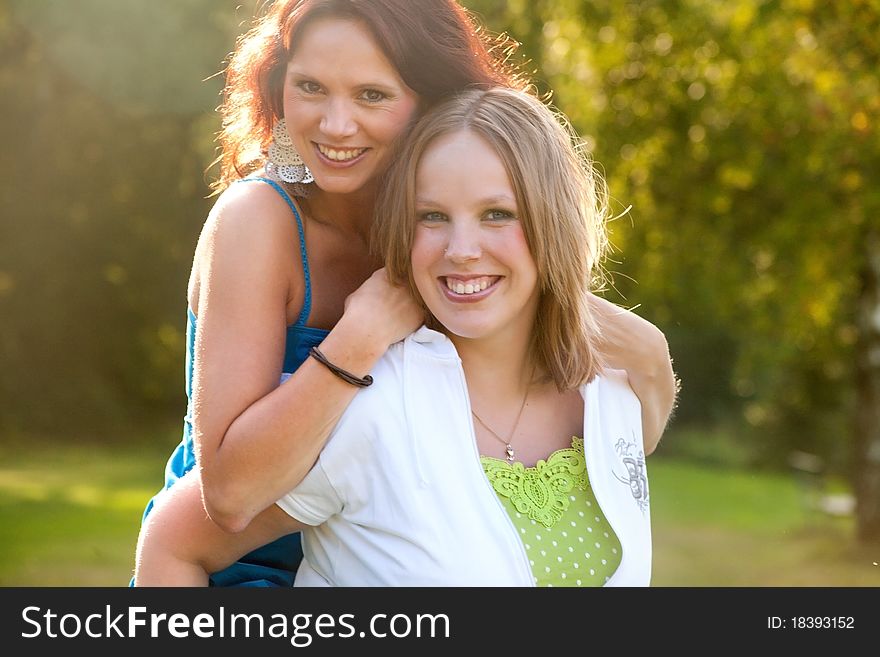 Girlfriends are having fun in the park. Girlfriends are having fun in the park