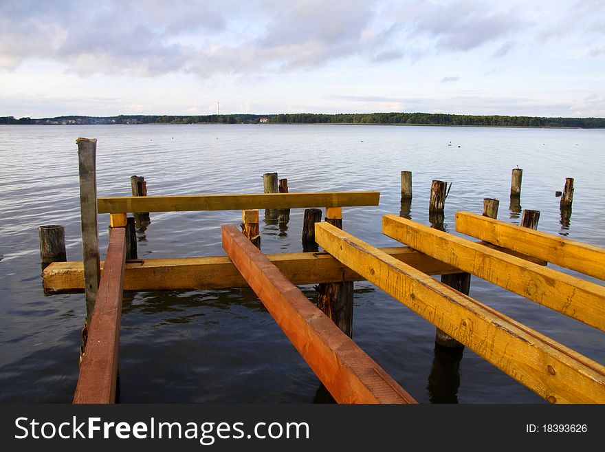 An old abandoned pier on a lake. An old abandoned pier on a lake