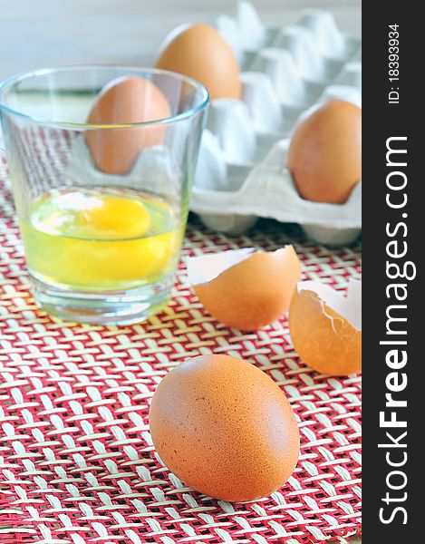 Eggs details and glass isolated in studio