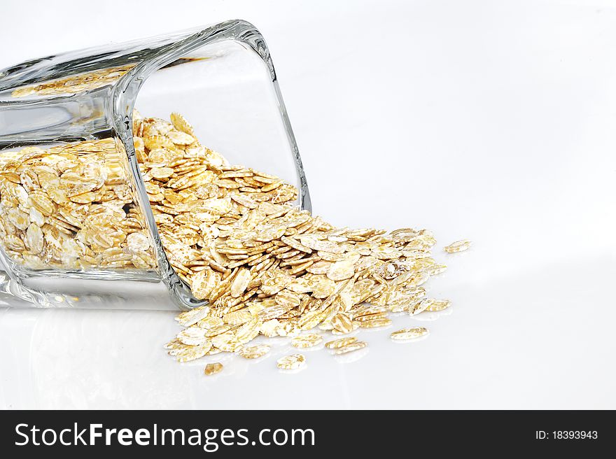 Barley flakes isolated on white background