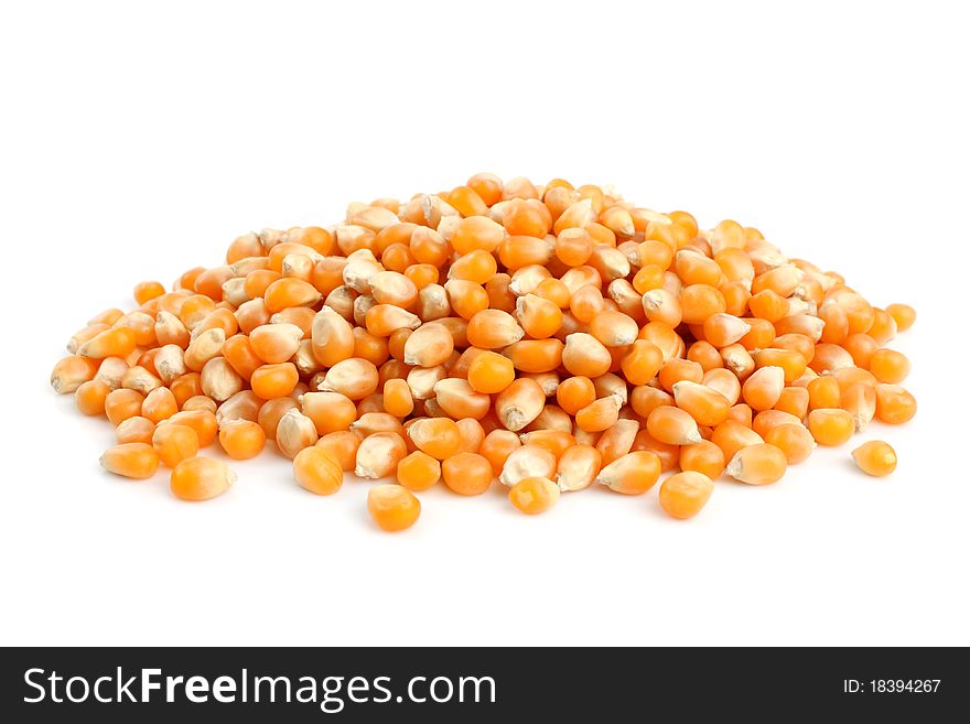 Whole corn kernels on a white background