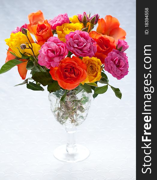 Bouquet of multi-colored roses in vase
