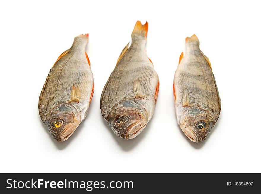 Three salted fish on a white background