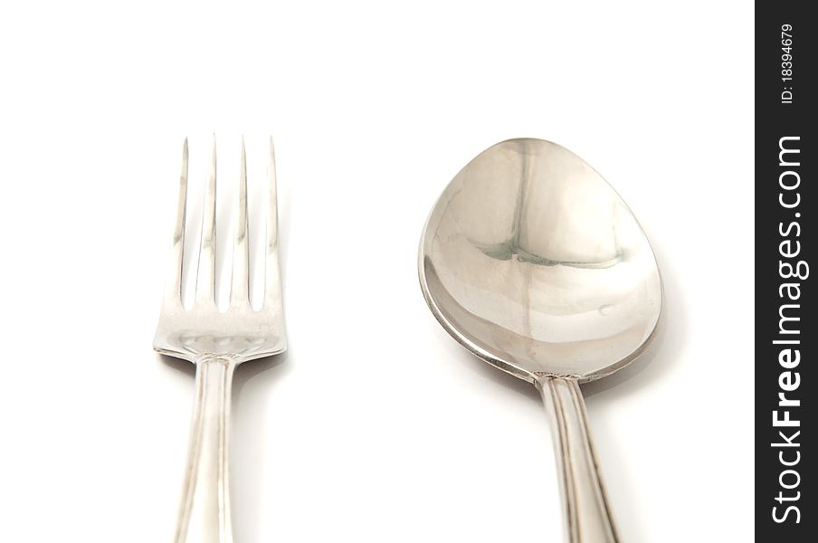 Spoon and fork on a white background