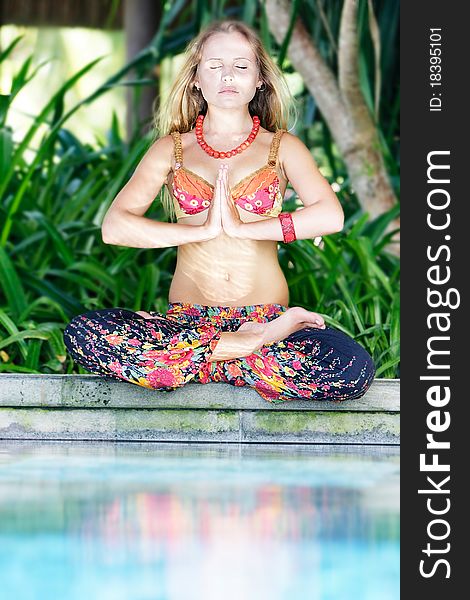 Young beautiful woman meditating on natural background. Young beautiful woman meditating on natural background