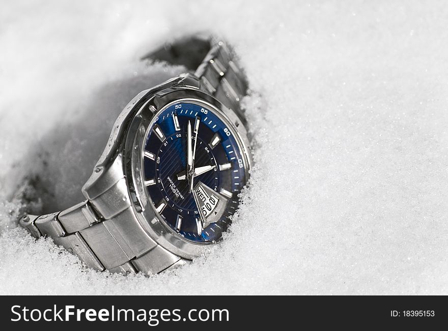 The Male watch with bracelet,resting upon snow. The Male watch with bracelet,resting upon snow.
