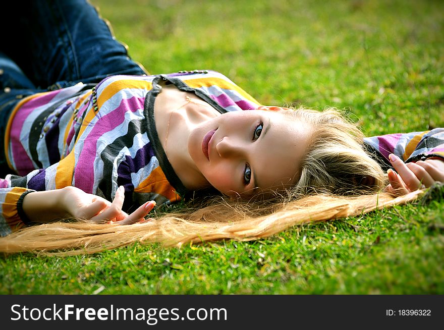 Portrait of the girl lying on a grass. Portrait of the girl lying on a grass